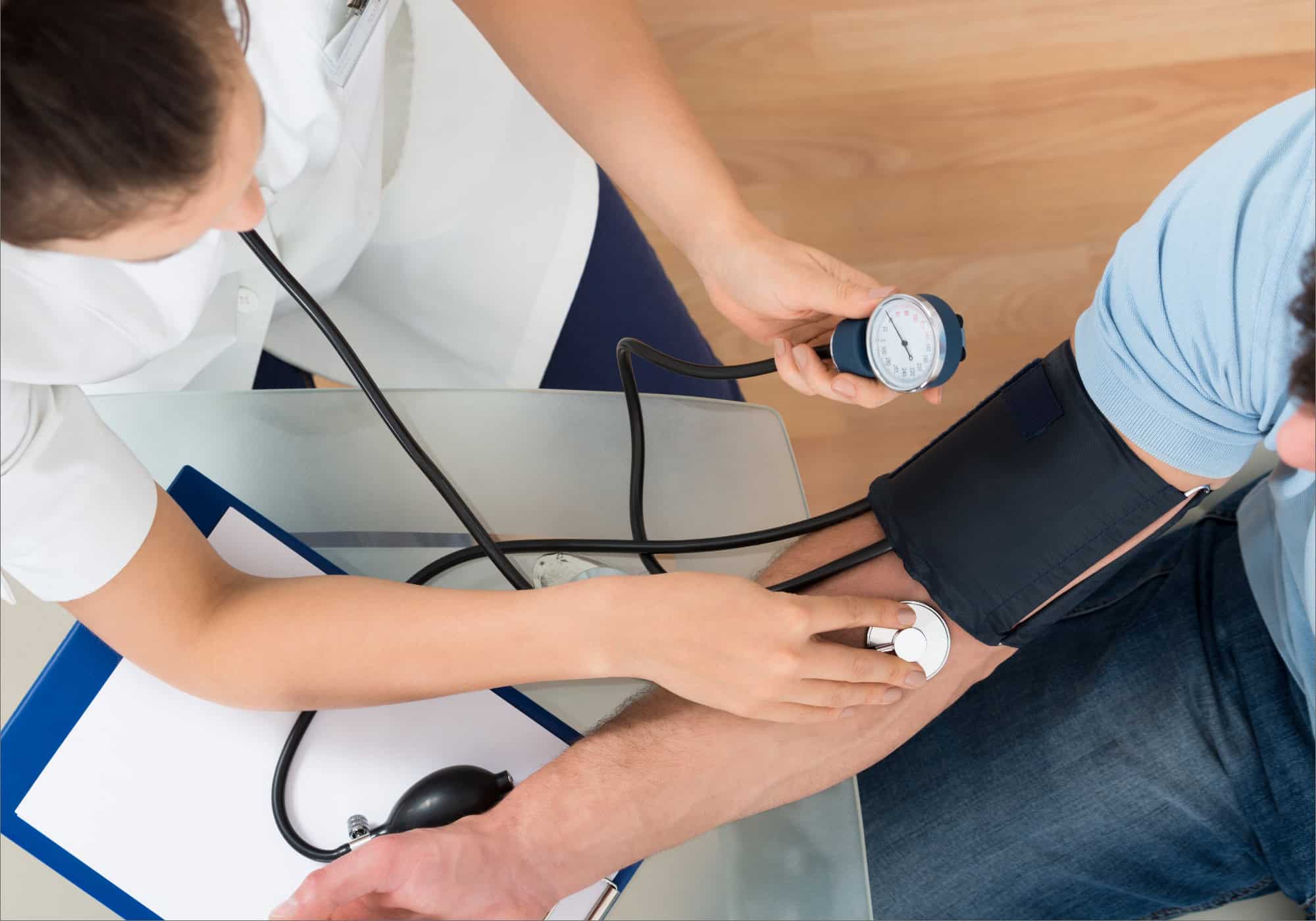 Health professional checking blood pressure during a wellness check at Life Care.